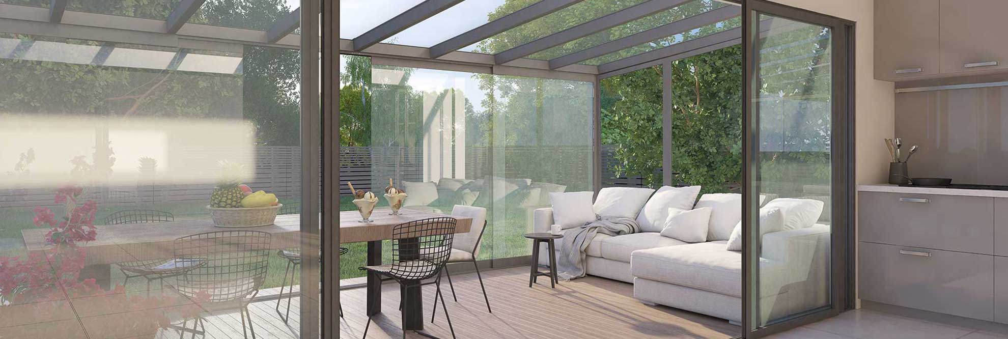 Glass canopies covering a table and sofa in a modern house