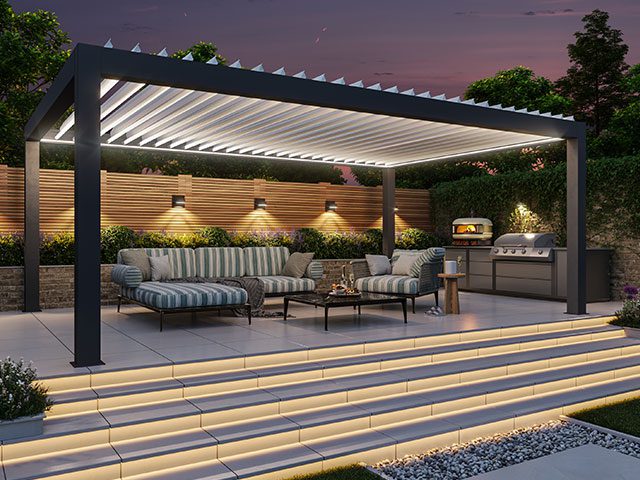 Modern garden pergola shading outdoor garden furniture set in a beautiful evening landscaped backyard